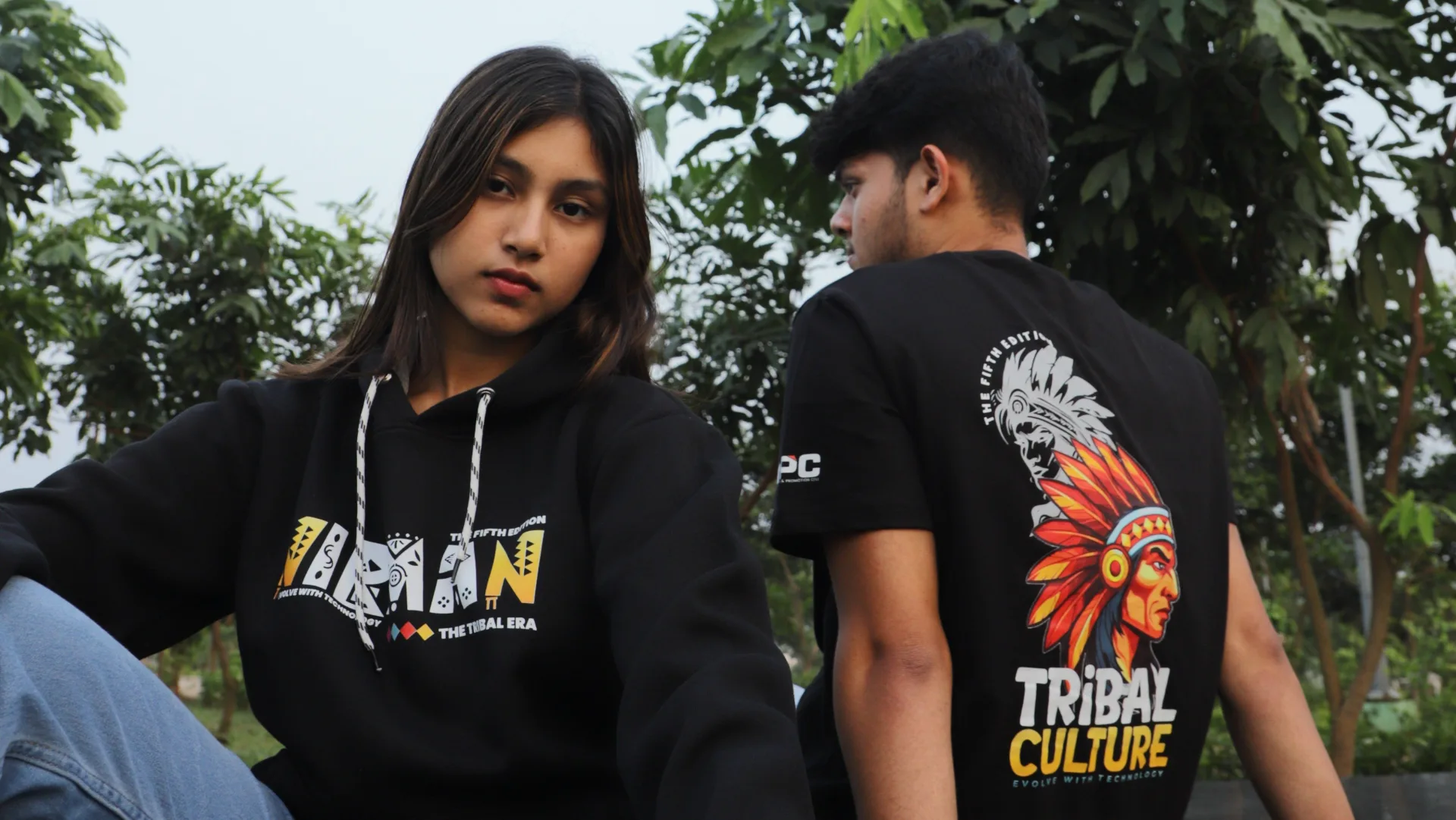 Nirman 5th edition Silicon University tribal culture themed round neck tees and varsity jackets in warm yellow and white