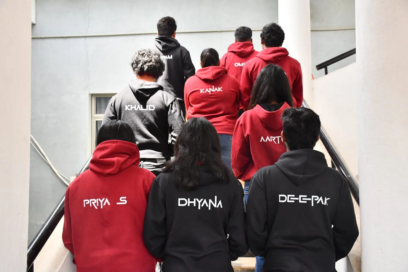 Ximera 2025 XIME Bengaluru personalised black 300 GSM pullover hoodie with student name printed on the back